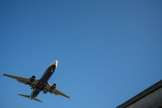 Bergamo, Italy - April 6, 2026: Dynamic shot of a commercial airplane landing at Orio al Serio Airport (BGY) in Bergamo, Italy, on a bright and sunny spring day