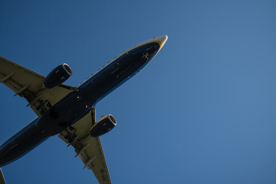 Bergamo, Italy - April 6, 2026: Dynamic shot of a commercial airplane landing at Orio al Serio Airport (BGY) in Bergamo, Italy, on a bright and sunny spring day