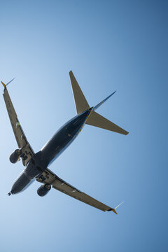 Bergamo, Italy - April 6, 2026: Dynamic shot of a commercial airplane landing at Orio al Serio Airport (BGY) in Bergamo, Italy, on a bright and sunny spring day
