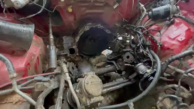 Car Engine Removed from Engine Bay &ndash; Auto Repair Workshop Mechanical Process Close-Up, showing internal mechanical components, wiring, and empty engine compartment inside an auto repair workshop.
