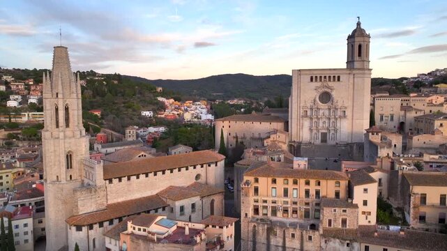 Girona at Sunset time, Aerial Shot. Fly over the Historical Center with Colorful Houses and Cathedral of Girona, Spain.