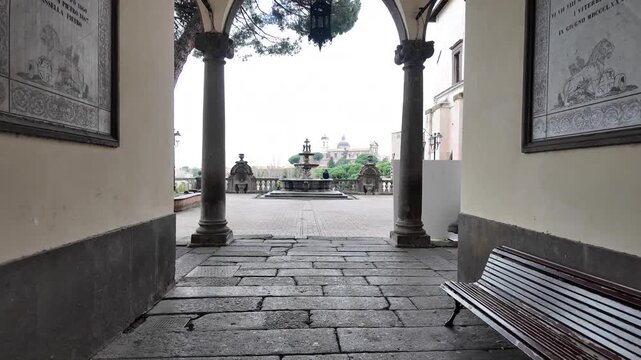 Walking Through Archway To Courtyard Fountain Palazzo Dei Priori Viterbo