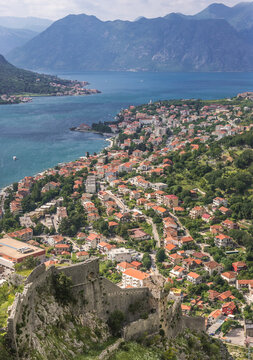 Aerial view from walls of St John Fortress in Kotor with Dobrota town on background, Montenegro
