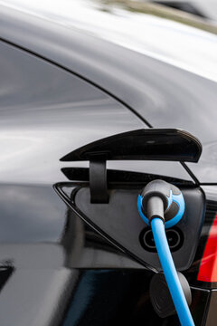 Germany electric vehicle technology with car charging cable and plug highlights energy mobility shift for cleaner transport future