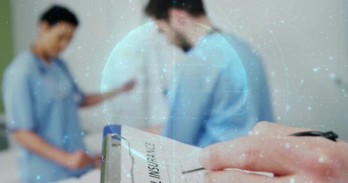Clinician noting medical care on blue clipboard, writing causing overlay while team caring patient