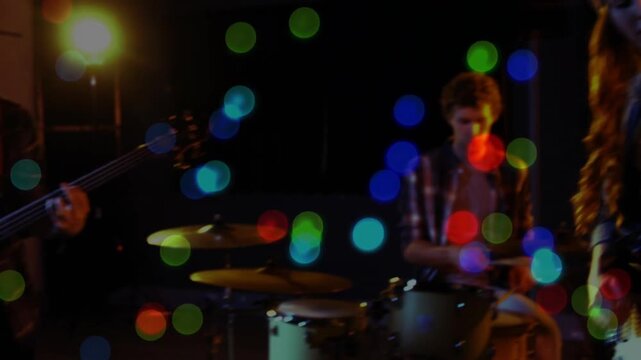 Drummer hitting kit starting beat, drawing lead singer to retro mic, singing music amid bokeh