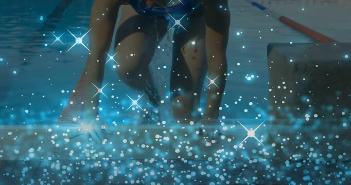 Swimmer pushing pool edge and climbing onto deck after lap for sports, blue sparkles obscuring legs
