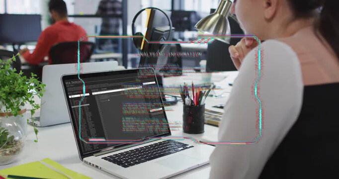 Software developer watching laptop while glitching HUD appearing, warping code for debugging
