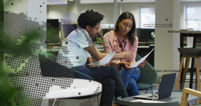 Vertical video: Man leaning pointing via globe film woman holding pages laptop aiding office review