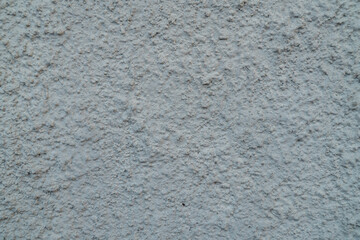 Fototapeta premium Rough cement wall texture with fine grain and neutral tone, minimal abstract background suitable for construction and design concept