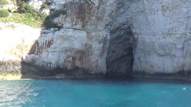 Unforgettable Greek island of Paxos. Mysterious caves in the sea. Majestic caves in the Ionian Sea