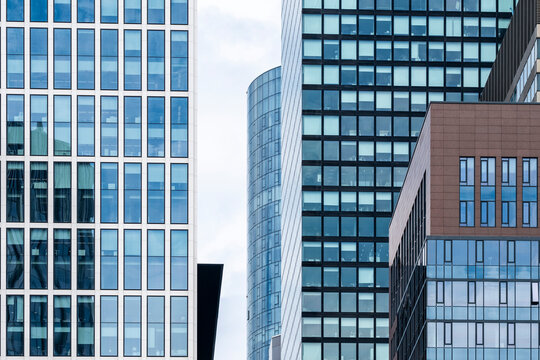 Glass pattern across modern facade of office skyscraper architecture in Frankfurt Germany Bankenviertel creating abstract grid for business use