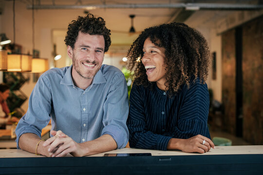 Happy couple sitting at cafe