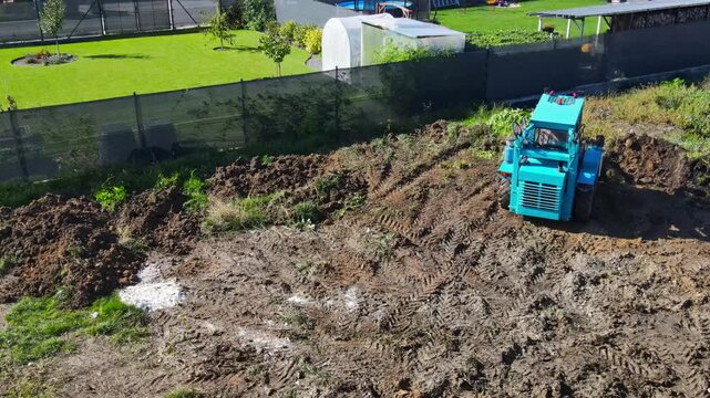 Aerial view of a tractor leveling the ground