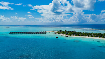 The Tropical aerial view with maldives paradise scenery seascape with water villas as amazing sea and lagoon beach, Exotic tourism © SASITHORN