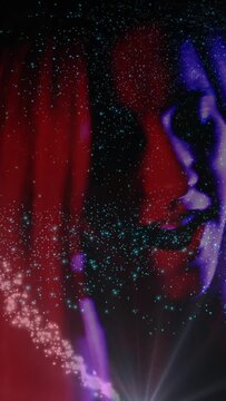 Vertical video: Singer moving head, singing under red blue light, glitter emerging right over face