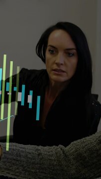 Vertical video: Woman leaning to pad as peer pointing, seeing animated biz charts rising for recap