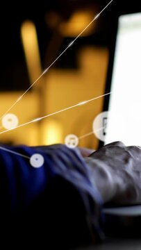 Vertical video: User typing on laptop, phone note chat icons forming tech network over hand, screen