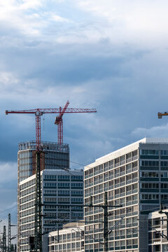 Berlin industry growth shapes the business core where construction crane stands over office architecture buildings urban development momentum