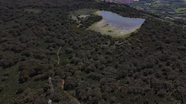 Aerial View of Turquoise Lake in Green Hills Gesturi