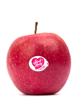 Pink Lady apple with label isolated on white background