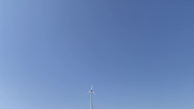  Single Wind Turbine Against Clear Blue Sky Minimal Renewable Energy Concept