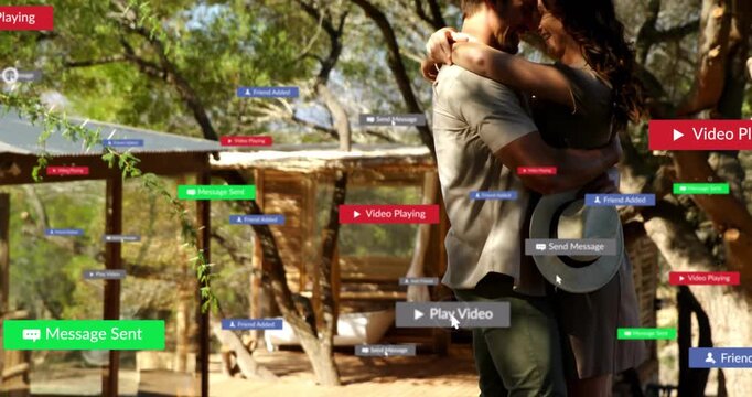 Embracing outdoors, couple receiving animation with digital message notifications