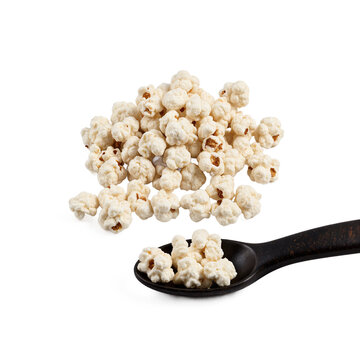 Popcorn snack spoon pile of white sugar-coated corn puffs isolated on a transparent background for food design