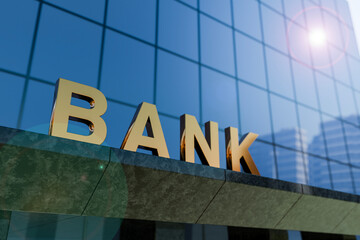 Fototapeta premium Bank building with modern glass facade and golden sign, low angle view with sunlight lens flare, financial institution and corporate business concept