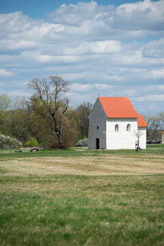 The ancient Church of St. Margaret of Antioch in Kopcany, a unique pre-romanesque stone chapel from the Great Moravian Empire standing in a spring field, Kopcany, Slovakia