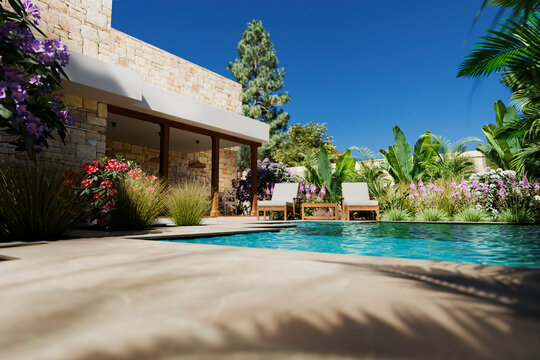 Luxury swimming pool design and garden landscaping. Modern beach house architecture with tropical palms and trendy aesthetic materials. Hotel villa resort with private pool rental.