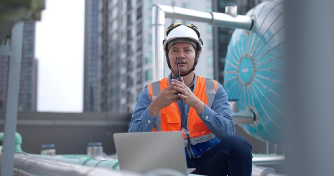 Green HVAC engineers communicate with clients on energy efficiency of HVAC systems on tower buildings, energy usage, renewable technology integration for reducing co2 emissions aligning with standard
