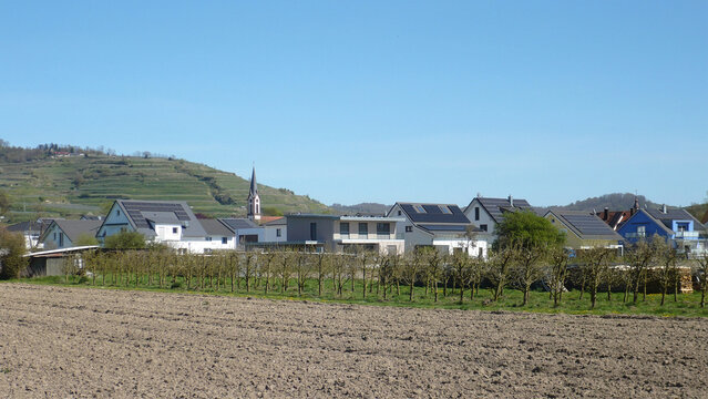 Sunny Landscape with Village and Plowed Field