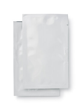 Two white blank packaging sachet bags