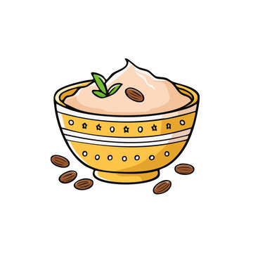 Delicious almond flavored dessert or dip in a decorative yellow bowl with whole almonds sprinkled around