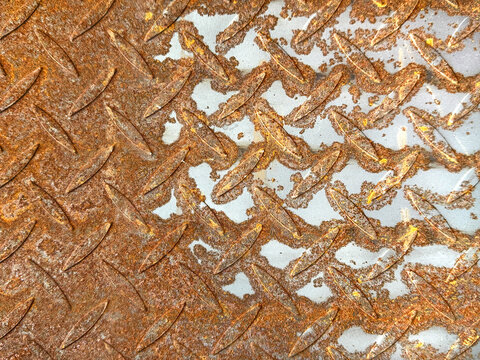 Close up of oxidized metal checker plate or tread plate. Chemical oxidation made metal color into blue. Seamless oxidized tread plate background texture