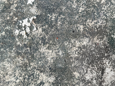 Weathered and corroded cement concrete textured paint of a surface. Suitable for flooring, wall, old ruins, building, stone, and other materials. Seamless background texture