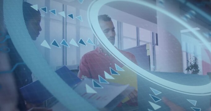 Vertical video: Overlay sweeping, two colleagues exchanging folders and reviewing charts to decide