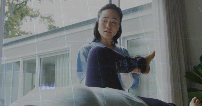 Woman PT lifting bent leg, rotating foot while checking ROM, HUD overlaying limb, gridlines numbers