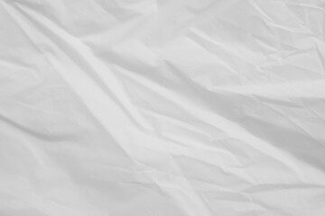 Obraz premium Crumpled white plastic bag texture, wrinkled polyethylene film background