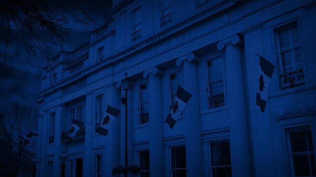 Grand Building With Canada Flags At Night
