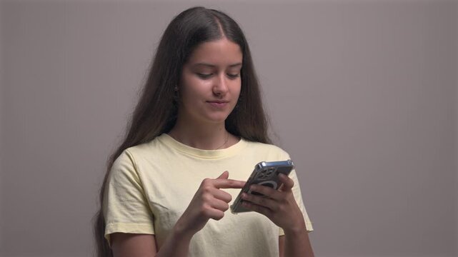 Woman Using Smartphone in Neutral Space