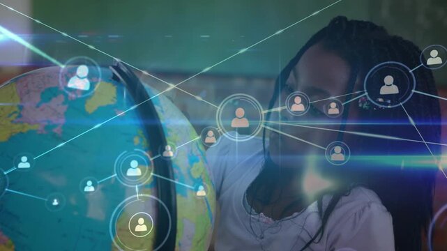 Animation of network of profile icons over african american girl touching a globe model at school