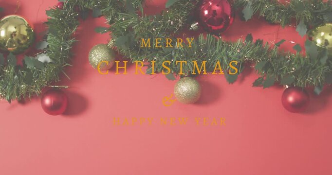 Animation of christmas greetings text over christmas decorations