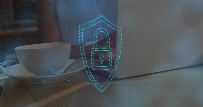 Animation of lens flares and padlock in shield over midsection of businesswoman using laptop