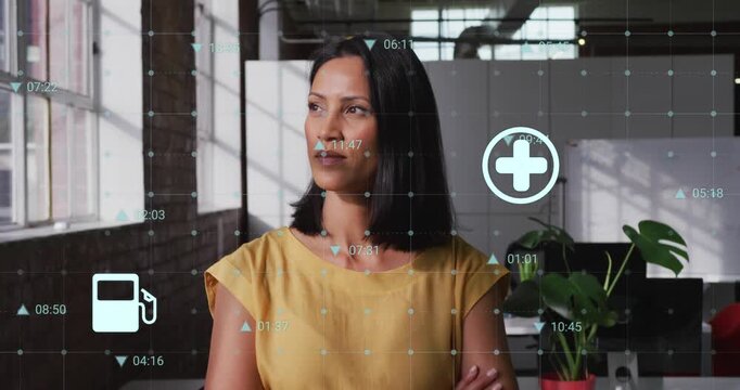 Animation of changing numbers and icons over woman standing arms crossed in office