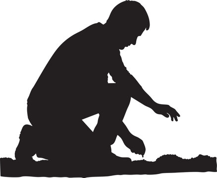 Silhouette of a person crouching down and interacting with the ground, crouching