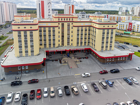 High-angle drone shot (top-down / bird's-eye view) of the main building of City Polyclinic No. 5 (GAUZ TO "Gorodskaya poliklinika No. 5") in Tyumen, Russia, captured on September 12, 2022, using a DJI