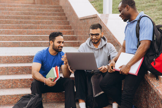 Diverse Group of Students Studying Together Outdoors on College Campus Steps