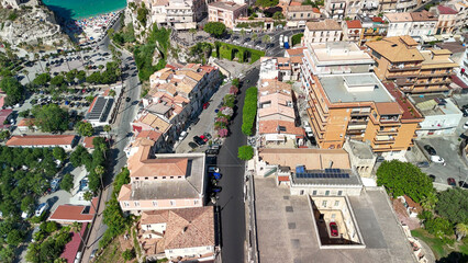 Fototapeta premium Drone perspective of Tropea in summer showing turquoise sea and scenic coastal landscape